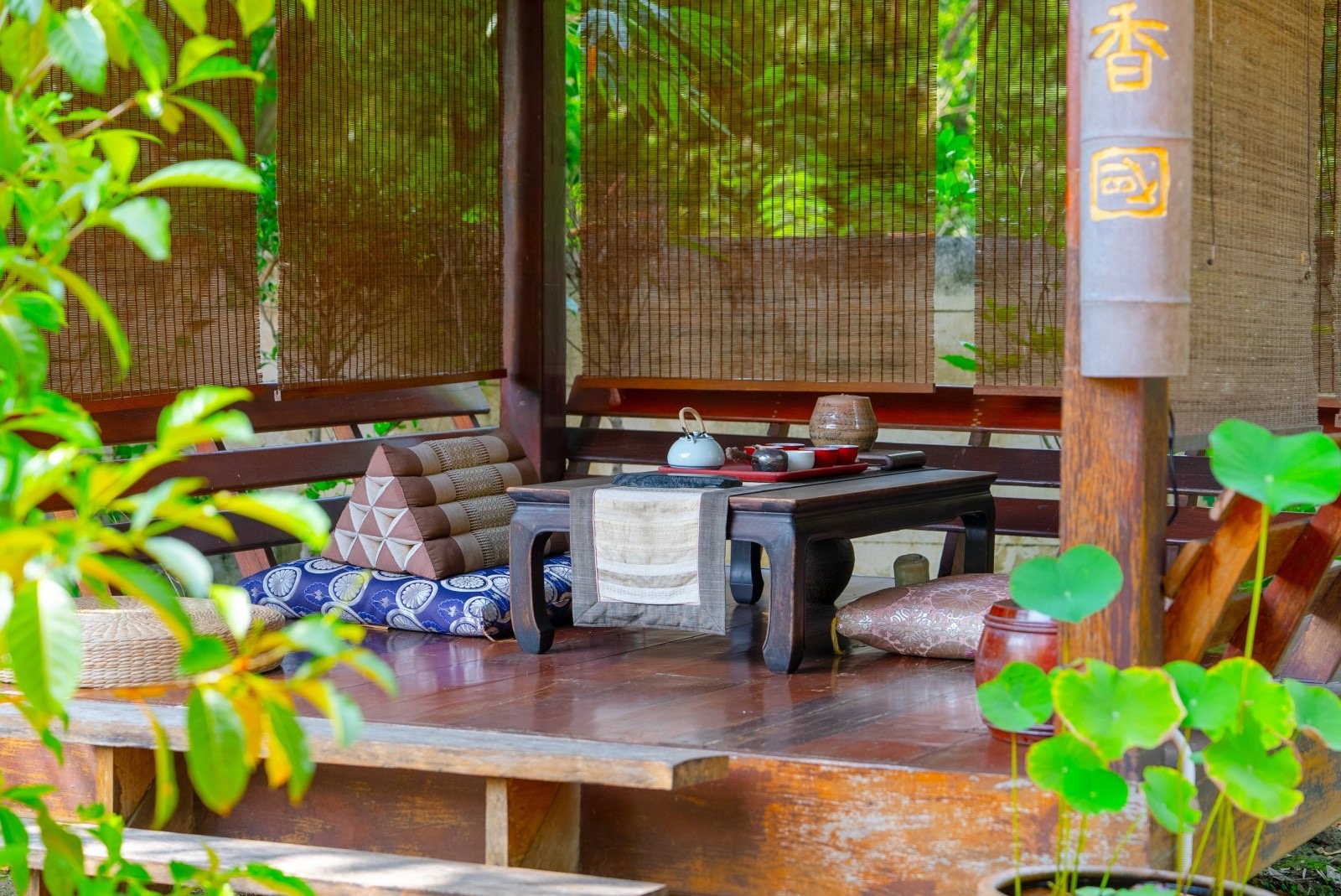 Inside the bamboo pavilion with lotus and tea