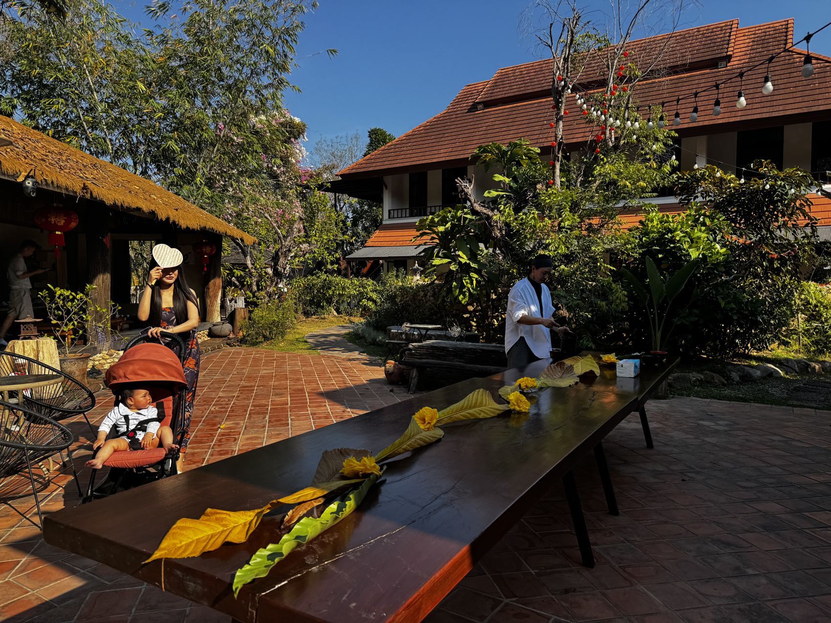 Guests at the long table under the pavilion