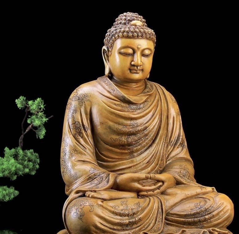 A seated gilt Buddha from the collection