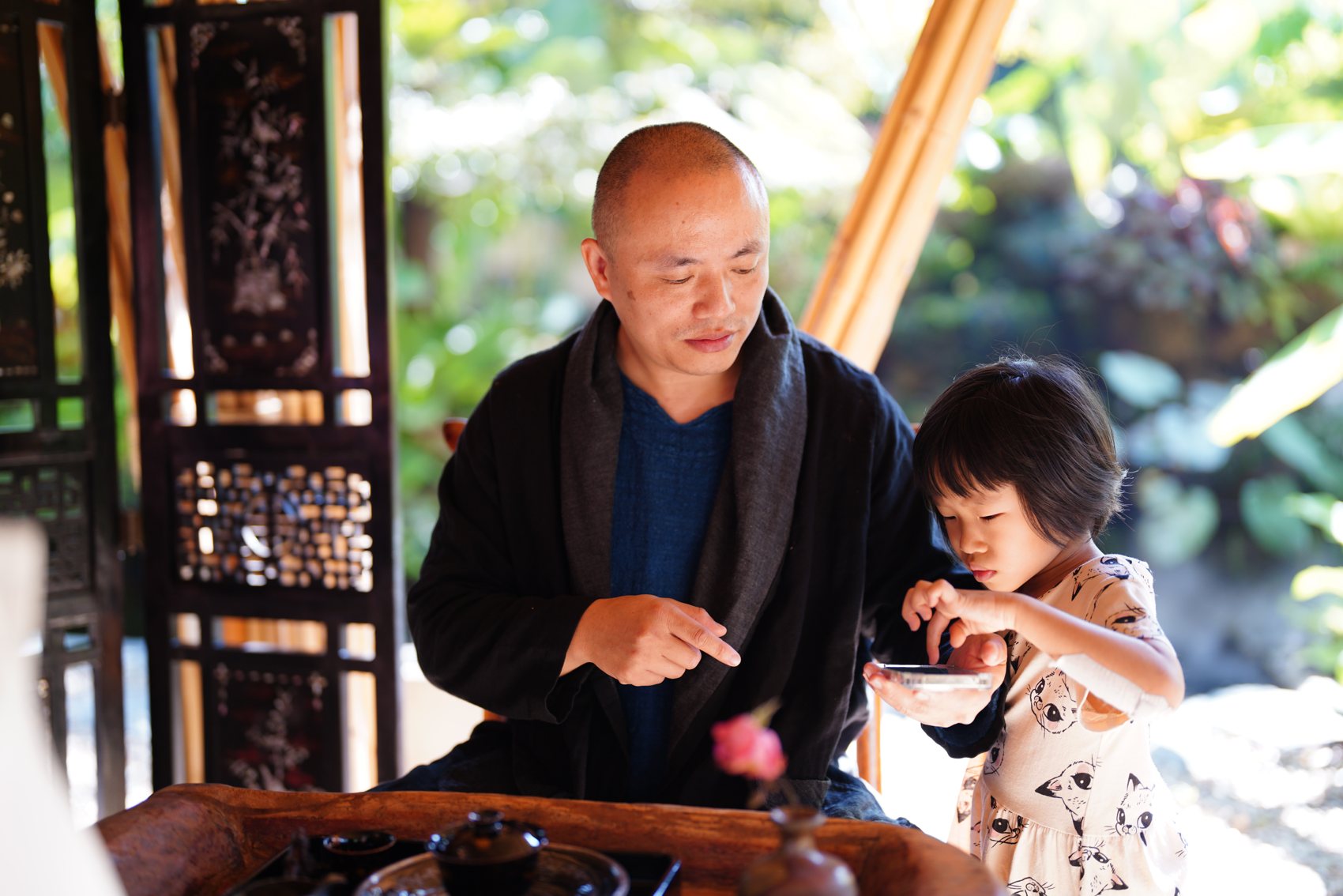 Ernan with his daughter at the tea table