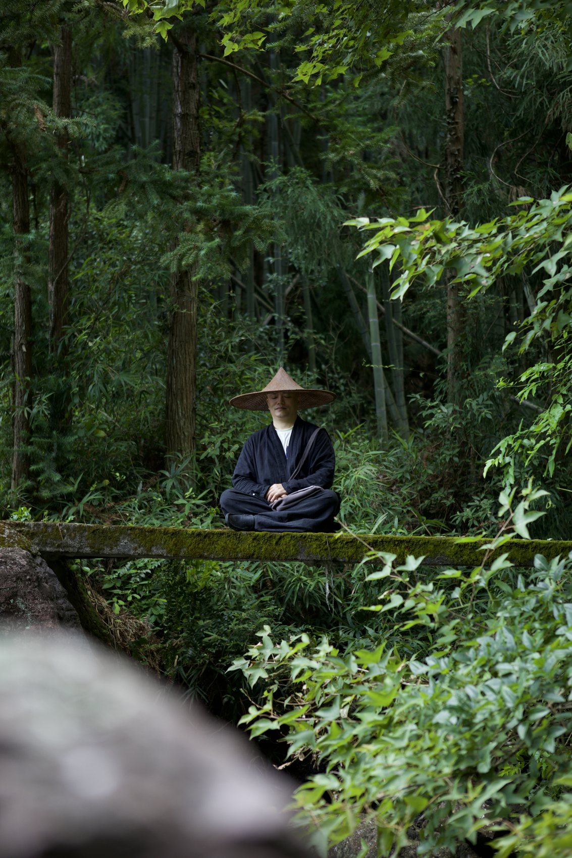 Ernan seated in meditation in the forest
