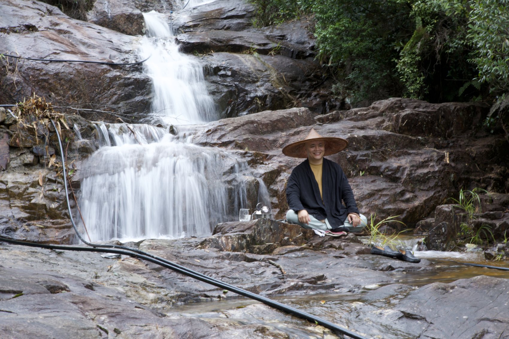 Tea laid beside the waterfall
