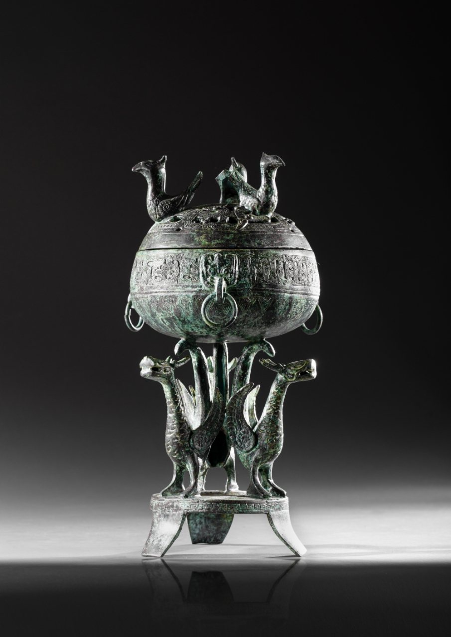 Bronze dou on tripod