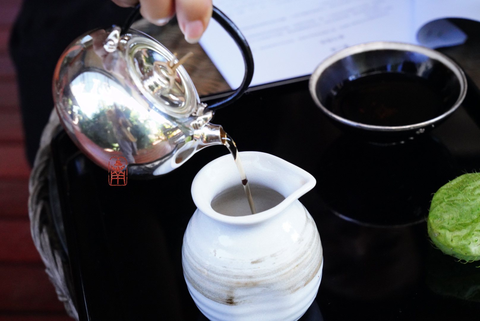 Pouring from the silver kettle