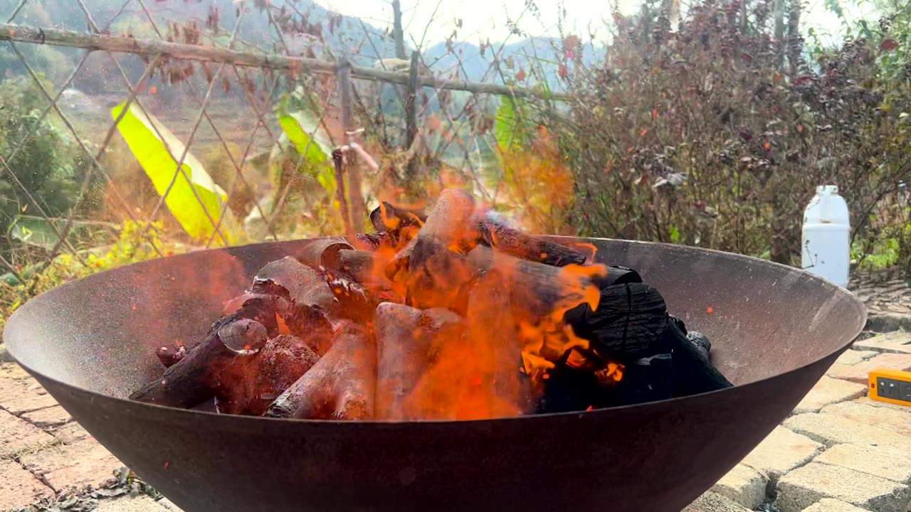 Charcoal catching fire in an iron basin