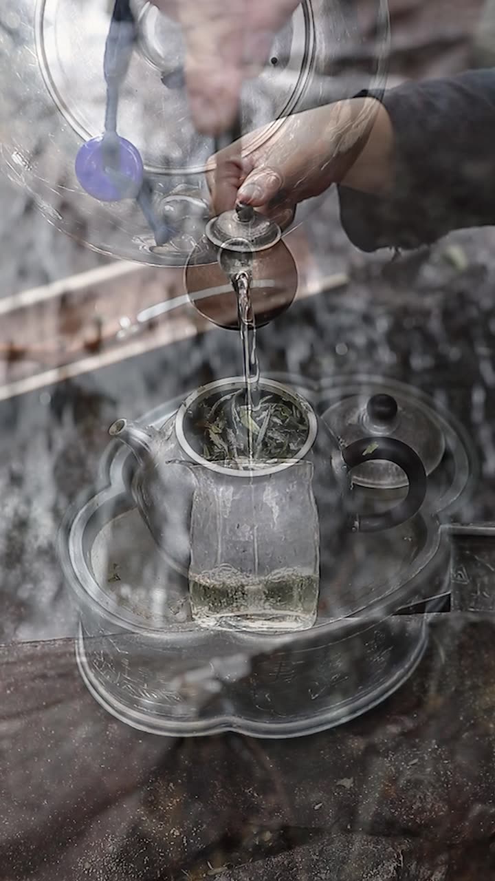 Pouring tea beside the waterfall
